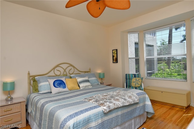 bedroom featuring ceiling fan and light hardwood / wood-style flooring