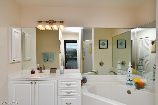 bathroom with vanity and a bathing tub