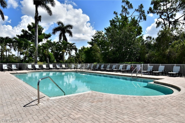 view of swimming pool with a patio area