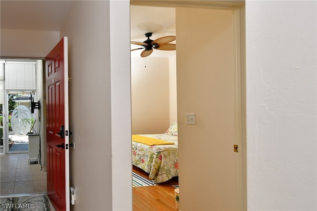 hall featuring tile flooring