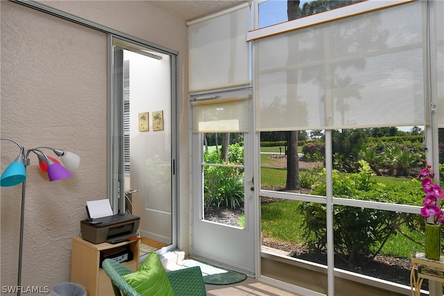 unfurnished sunroom featuring a wealth of natural light