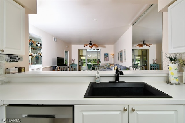 kitchen featuring dishwasher, white cabinetry, sink, and ceiling fan