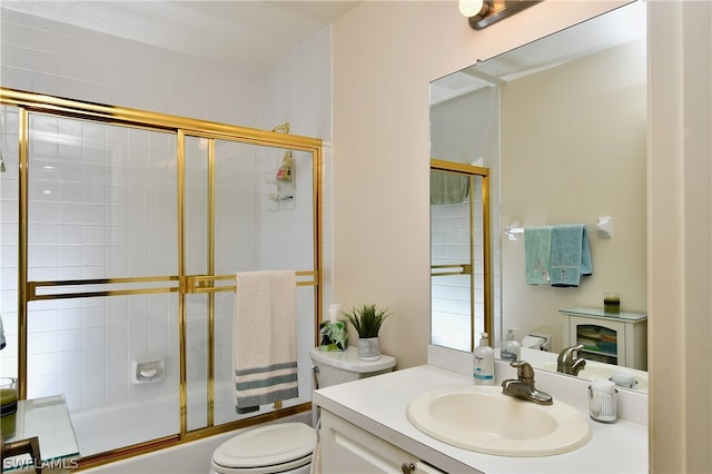 full bathroom with shower / bath combination with glass door, toilet, and vanity with extensive cabinet space