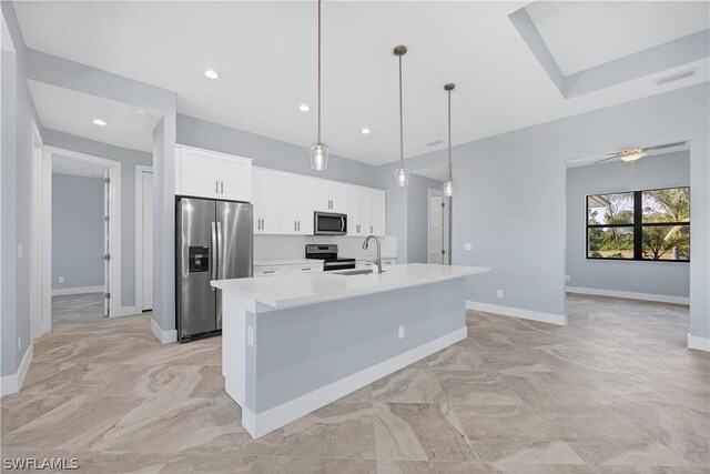 kitchen featuring hanging light fixtures, a center island with sink, appliances with stainless steel finishes, sink, and light tile floors