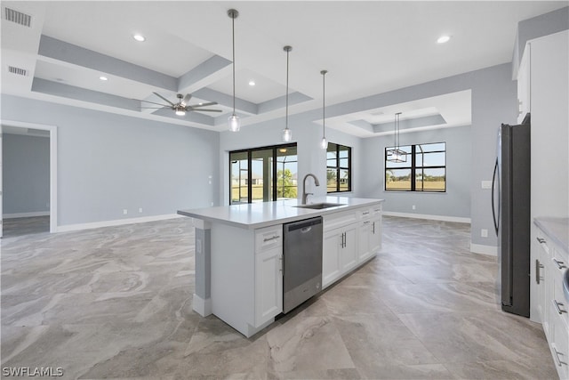 kitchen featuring white cabinetry, appliances with stainless steel finishes, a kitchen island with sink, sink, and coffered ceiling