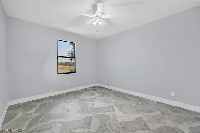 tiled empty room with ceiling fan