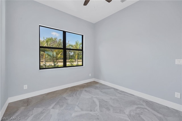 tiled empty room with ceiling fan