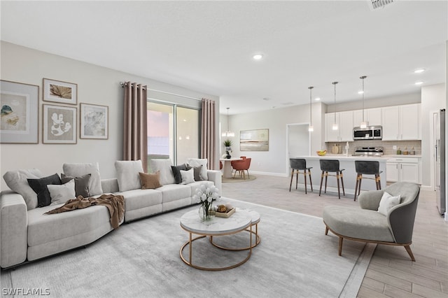 living room with light hardwood / wood-style floors