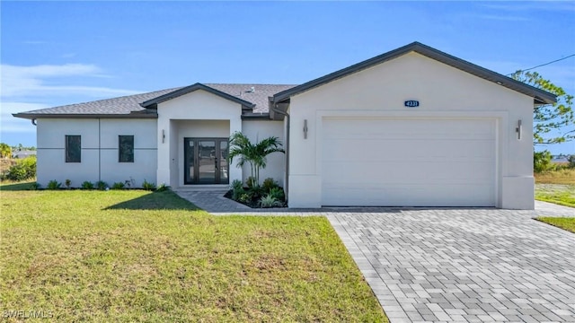 ranch-style home featuring a garage and a front yard