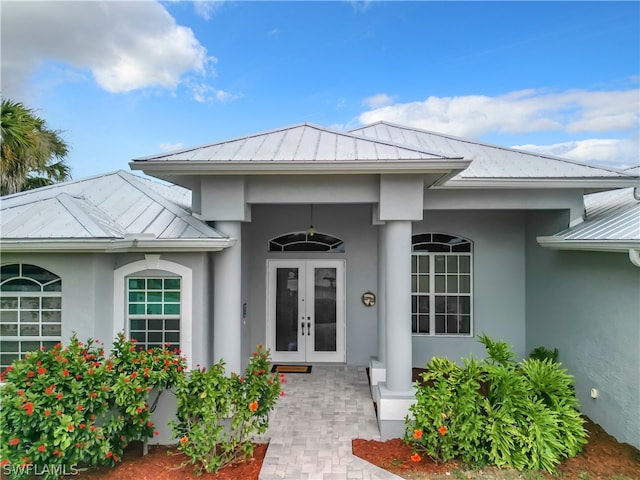 view of exterior entry featuring french doors