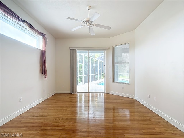 unfurnished room featuring ceiling fan and wood-type flooring