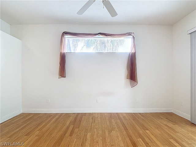 unfurnished room with ceiling fan and light wood-type flooring