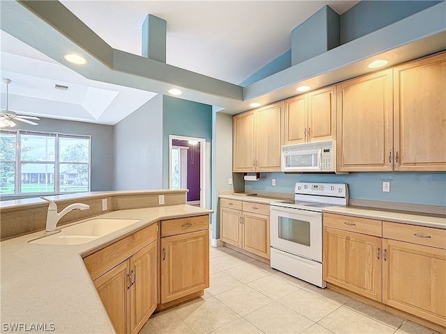 kitchen featuring white appliances, sink, light tile patterned floors, light brown cabinetry, and ceiling fan