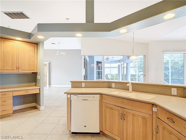 kitchen featuring light tile patterned flooring, light brown cabinetry, ceiling fan, sink, and white dishwasher