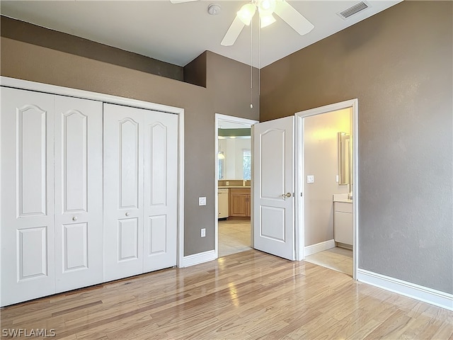 unfurnished bedroom with ceiling fan, a closet, and light hardwood / wood-style floors