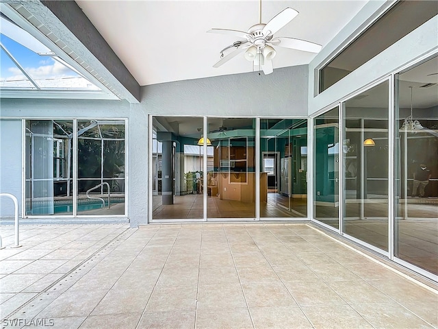 exterior space featuring ceiling fan and lofted ceiling