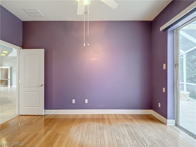 unfurnished room featuring light hardwood / wood-style flooring and ceiling fan