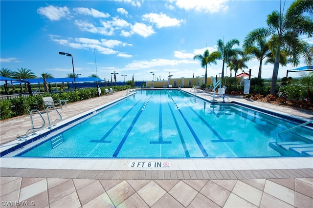 view of swimming pool with a patio area