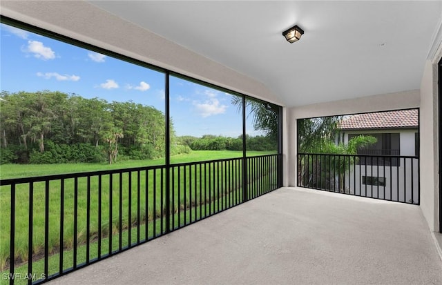 sunroom / solarium with lofted ceiling