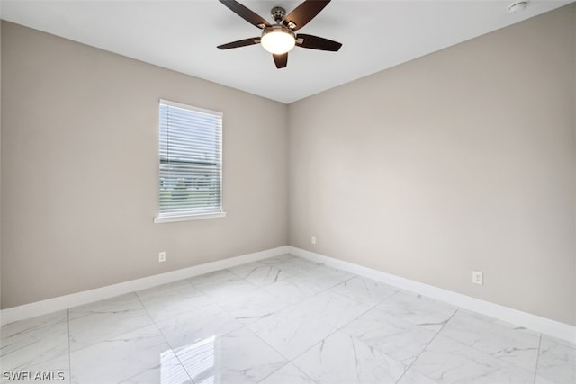 spare room with ceiling fan