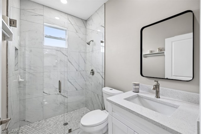 bathroom featuring walk in shower, vanity, and toilet