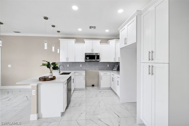 kitchen featuring hanging light fixtures, crown molding, backsplash, white cabinetry, and black dishwasher