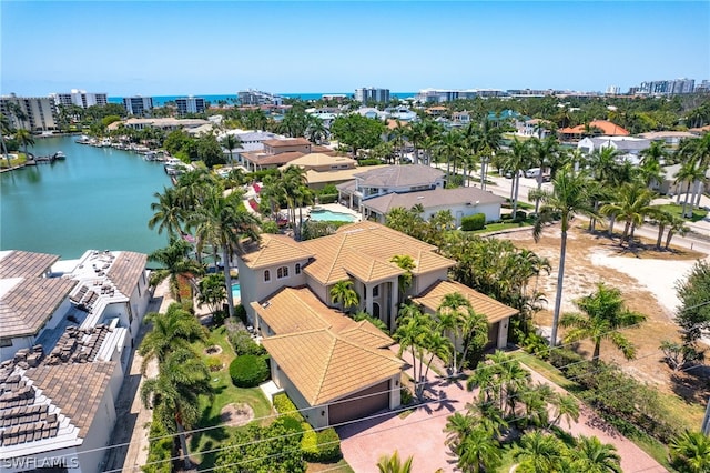 birds eye view of property with a water view