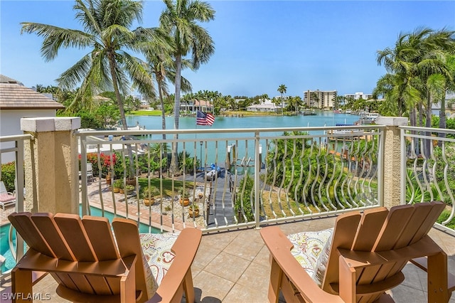 balcony featuring a water view