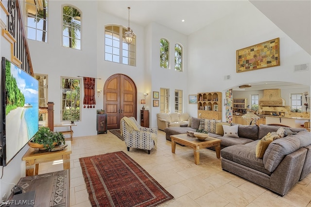 tiled living room featuring a high ceiling