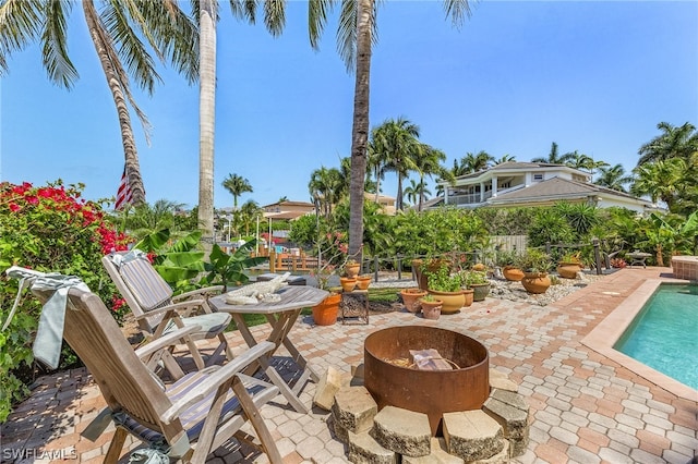 view of patio / terrace with an outdoor fire pit