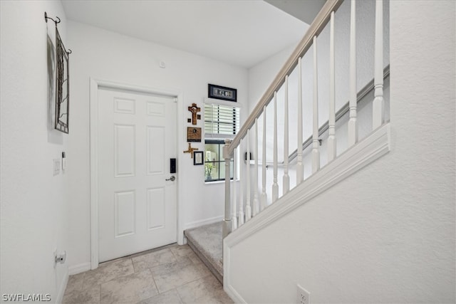 view of tiled foyer entrance