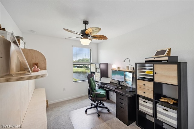 carpeted office with ceiling fan