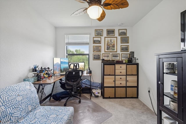 office with light carpet and ceiling fan