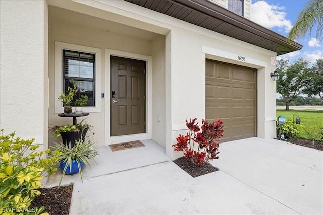 entrance to property featuring a garage