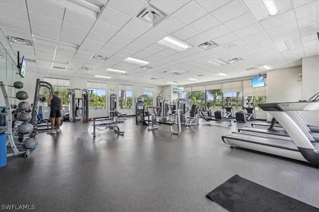 exercise room featuring a drop ceiling and visible vents