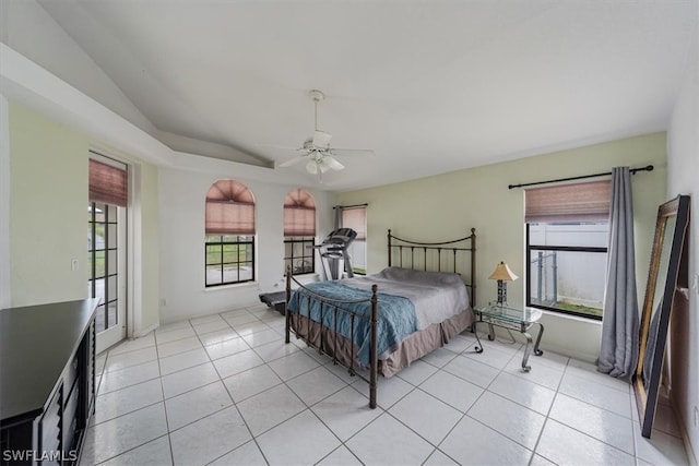 bedroom featuring multiple windows, light tile patterned floors, and ceiling fan