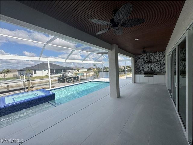 view of swimming pool featuring an in ground hot tub, area for grilling, and a patio