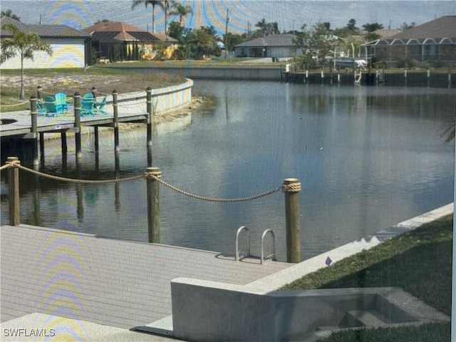 dock area featuring a water view