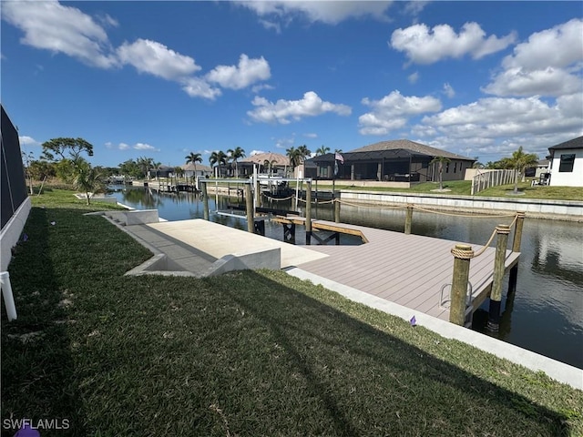 view of dock featuring a water view and a lawn