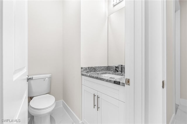 bathroom with toilet and vanity