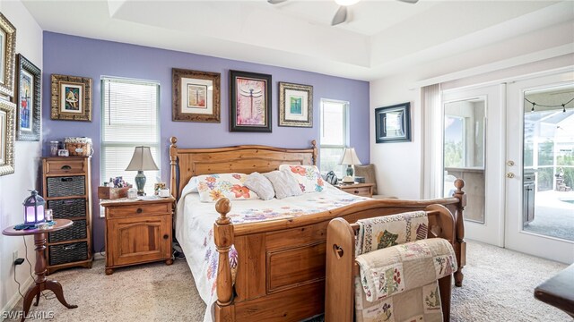 bedroom with multiple windows, access to outside, and ceiling fan