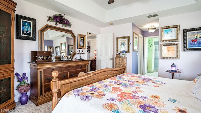 carpeted bedroom featuring connected bathroom and ceiling fan