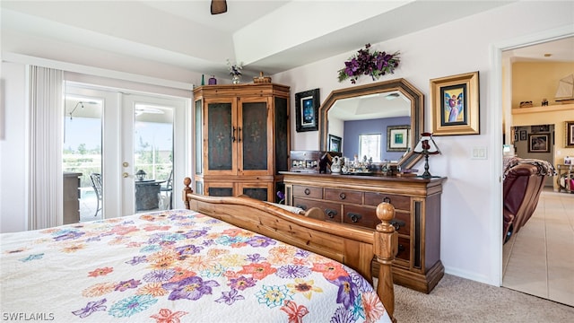 carpeted bedroom featuring french doors, access to exterior, and ceiling fan