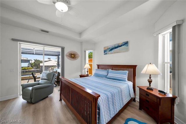 bedroom with wood-type flooring, multiple windows, and ceiling fan