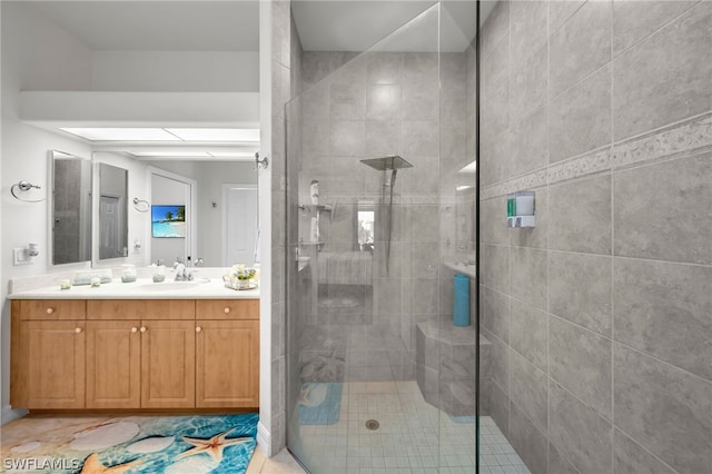 bathroom featuring walk in shower, tile flooring, and large vanity