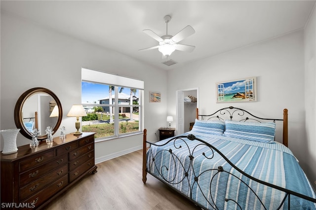 bedroom with hardwood / wood-style flooring and ceiling fan