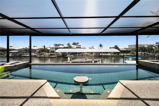 view of pool with a lanai, a dock, and a water view