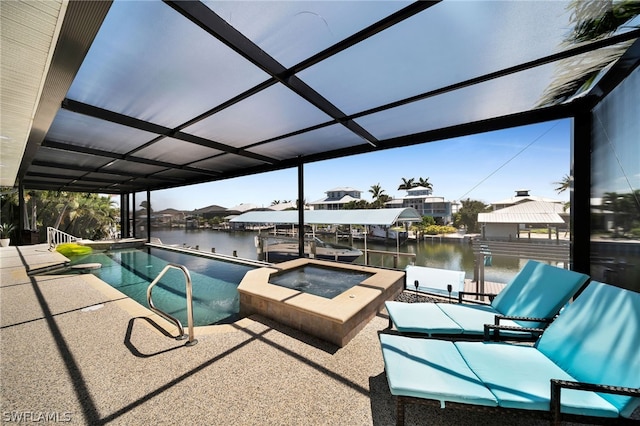 view of swimming pool with a dock, an in ground hot tub, and a water view