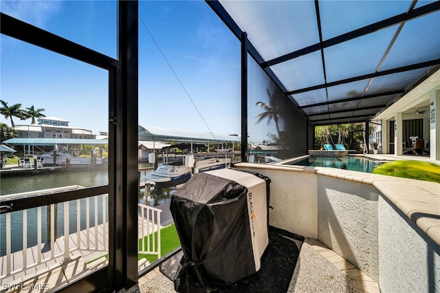 sunroom / solarium with a water view