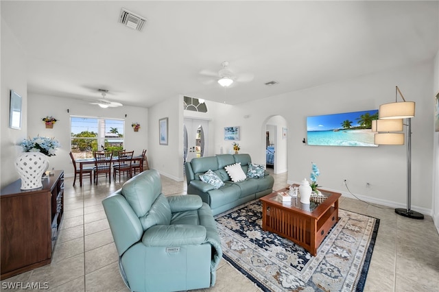 living room featuring ceiling fan and light tile floors